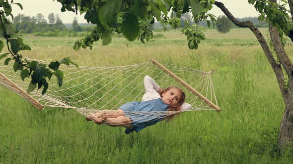 Girl Swinging in a Hammock Summer