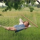Girl Swinging in a Hammock Summer - VideoHive Item for Sale