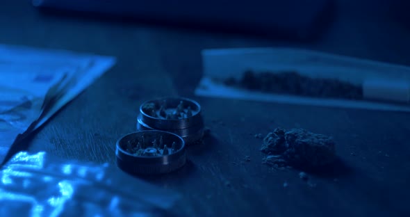 Man Rolling a Medical Marijuana Joint in Night Club