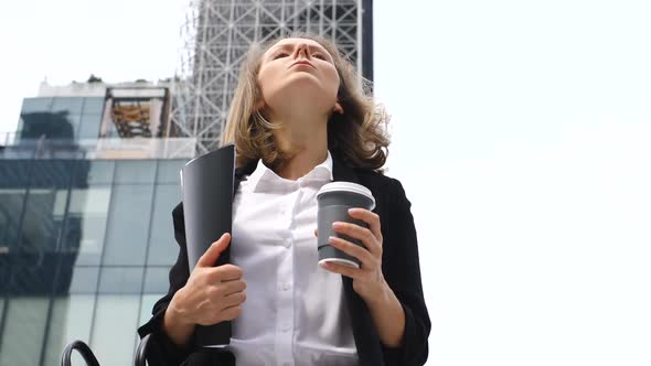 Portrait of Serious Business Woman Walking With Coffee Outdoor 