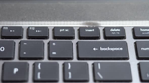 Backspace Button Pressing a Lot of Times on Keyboard Laptop Keyboard Close Up