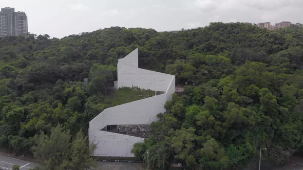 Sped up zoom out aerial drone shot of Pequena Lookout Point in Macau