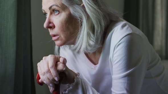 Portrait of senior caucasian woman sitting at home