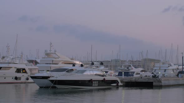 Yachts mooring Evening view of harbour in Alicante, Spain