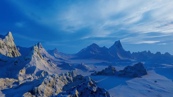 Flight over mountains covered with snow