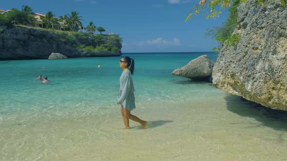 Playa Lagun Beach Cliff Curacao Lagun Beach Curacao a Small Island in the Caribbean Woman Mid Age on