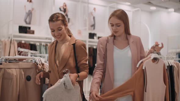 Young Women Shopping and Chatting