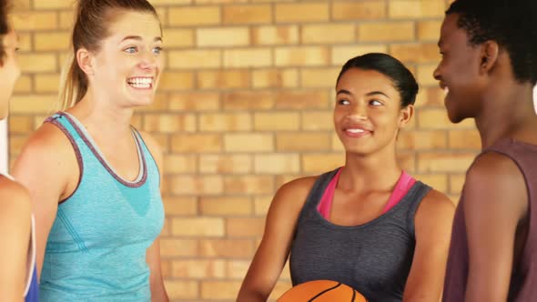 High school kids having fun in basketball court