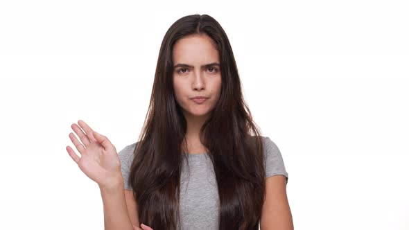 Portrait of Angry Longhaired Woman Negatively Shaking Head Saying No Waving Hands in Denial Over