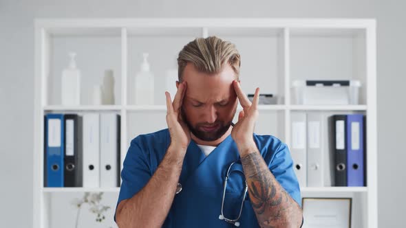 Professional medical doctor in hospital office, Portrait of young and confident physician.