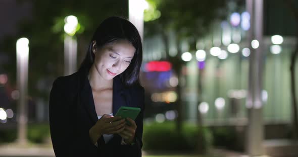 Businesswoman use of mobile phone at outdoor 