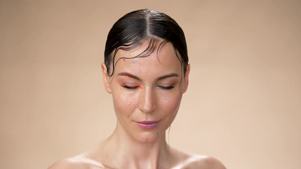 Young Woman with Wet Hair Looking at Camera and Looking at Camera