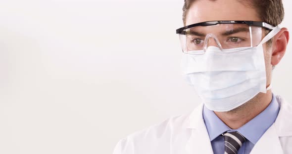 Lab technician checking blood sample in tube