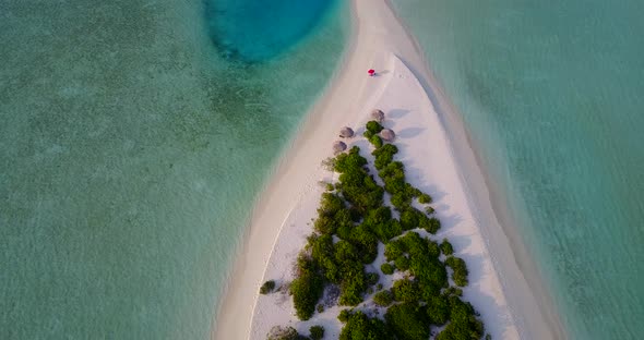 Luxury above copy space shot of a white paradise beach and blue water background in vibrant 