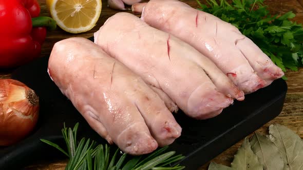 Chef Rubbing Piece of Pork Legs with Savoury Spices and Seasoning for Roasting