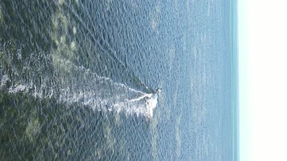 Vertical Video Kitesurfing Near the Shore of Zanzibar Tanzania Aerial View