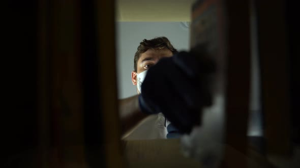 Man with Medical Mask and Protective Gloves Against the Virus