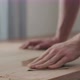 Slow Motion Slide Orbit Shot of Man Hand Sanding Black Walnut Wood Table - VideoHive Item for Sale