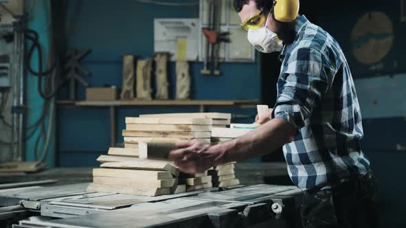 A Man Works with a Planer