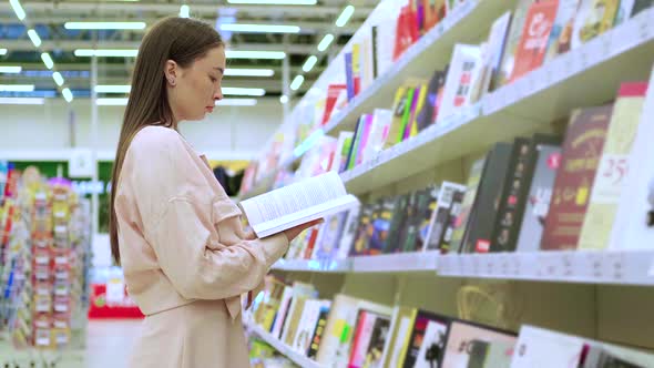 Girl Doing the Shopping in Book Store