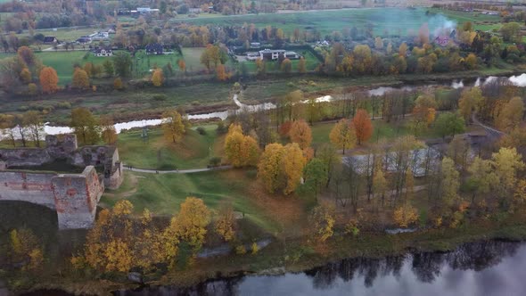 Bauska Medieval Castle Ruins Complex and Park From Above Aerial Shot 4K Video