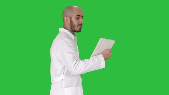 Sincere doctor making video call to his patient walking