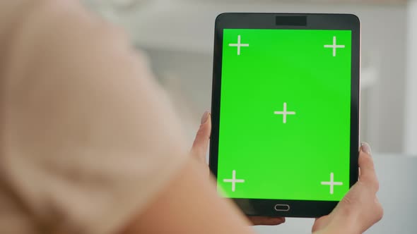 Close Up of Woman Hands Holding Tablet Computer with Mock Up Green Screen