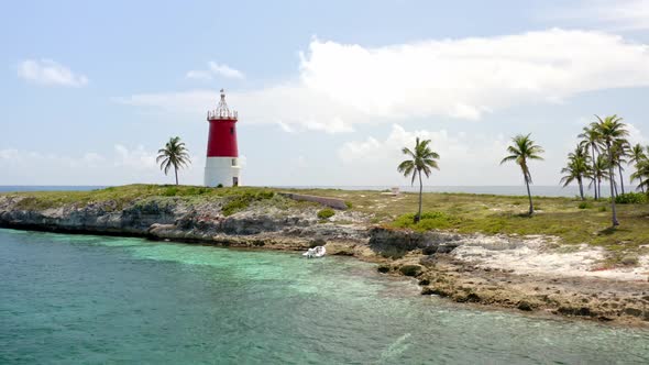 Abandoned Lighthouse On The Island Of Gun Cay In The Bahamas. drone pullback