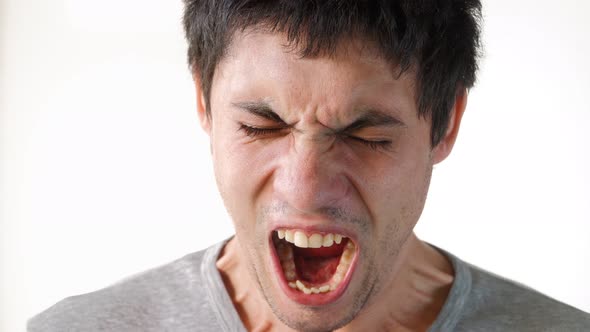 Portrait Angry Guy Yells Directly Into Camera. Male Emotions Close-up.