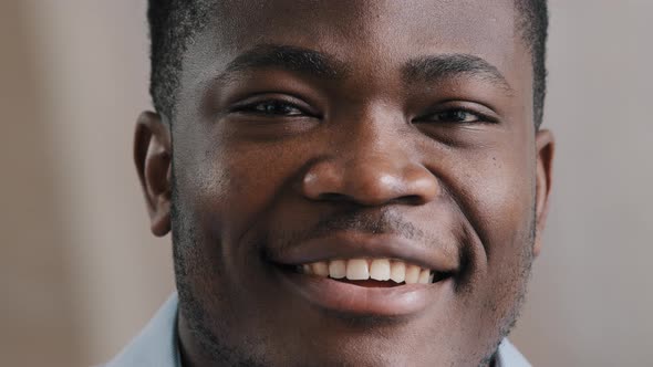 Close Up Portrait Smiling Handsome Young African Businessman Male Model Posing Indoors Looking at