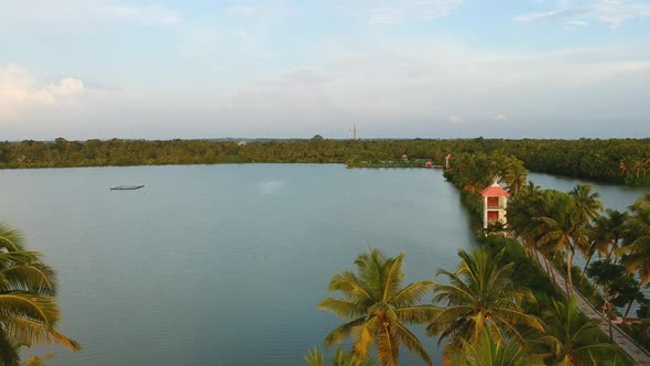 Vembanad lake fish farming aerial shot,coconut tree