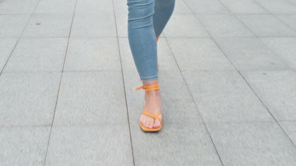 Close Up Shot of Feet of Businesswoman Walking on Pavement