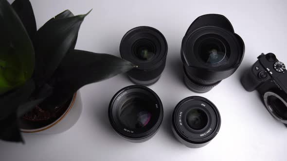 Sony photography lenses from up top laid on the white table