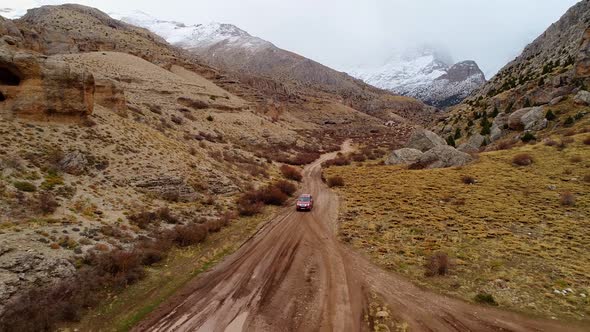 Car Driving On Mud Road