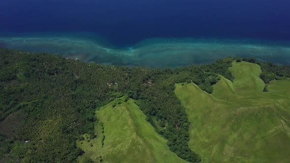 Tropical Blue Ocean Bay and Green Hills.