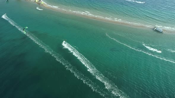 Aerial view of group kitesurfing in the Gulf of Patras, Greece.