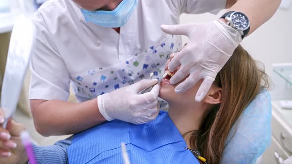 Portrait of patient in dental chair. Patient woman visit dentist in stomatology clinic