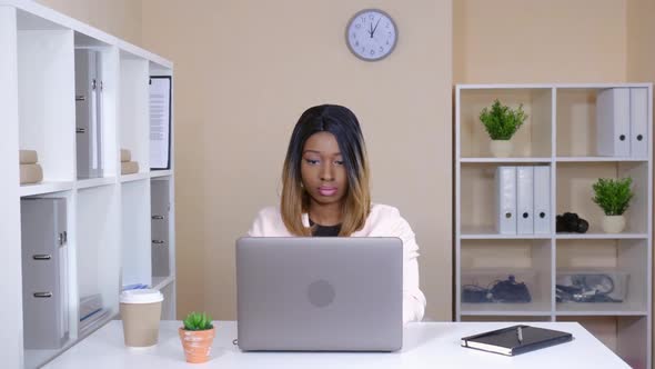 Beautiful Woman Works in Room with Casual Interior