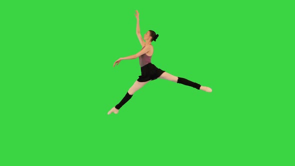 Young Ballerina Training a Jump on a Green Screen Chroma Key