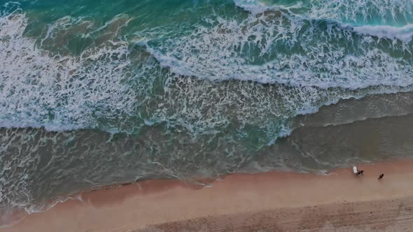 Aerial Top View of Beautiful Beach of Turquoise Ocean Water at Seaside Beach with Waves Aerial View