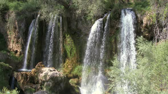 Side-By-Side Waterfalls Flowing From Different Places