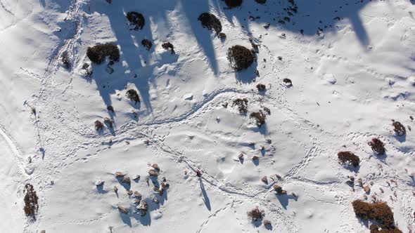 Aerial Shot of Hiker in the Beautiful Snow Mountains