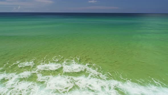 Phuket sea beautiful waves crashing on beach Aerial view