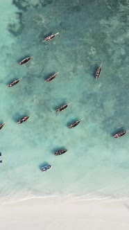 Vertical Video Boats in the Ocean Near the Coast of Zanzibar Tanzania