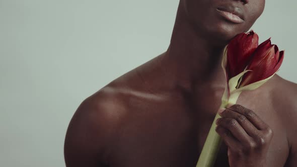 Black Man With Amaryllis Flower