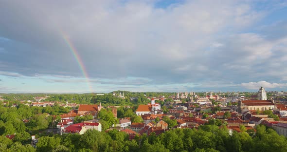 Rainbow in the Vilnius Old Town Golden Light and Rainbow at Warm Summer Day with Green Trees and