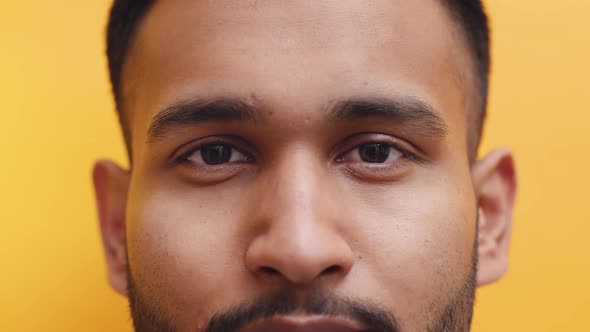 Young Indian Man Closing His Eyes And Nodding At The Camera  Closeup Portrait