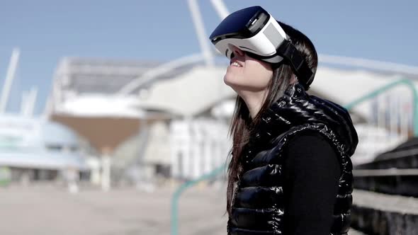 Smiling Woman in VR Headset on Street