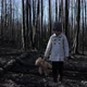 Little girl with teddy bear in burnt forest - VideoHive Item for Sale