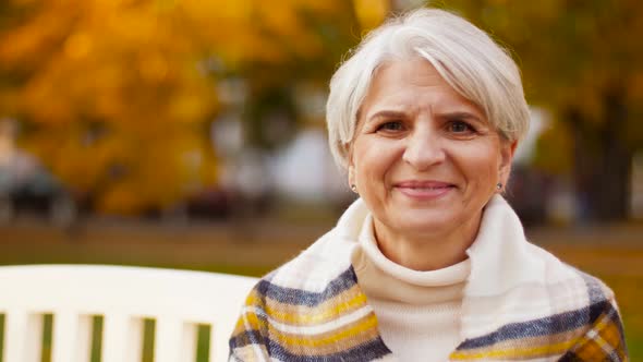 Portrait of Happy Senior Woman at Summer Park 38